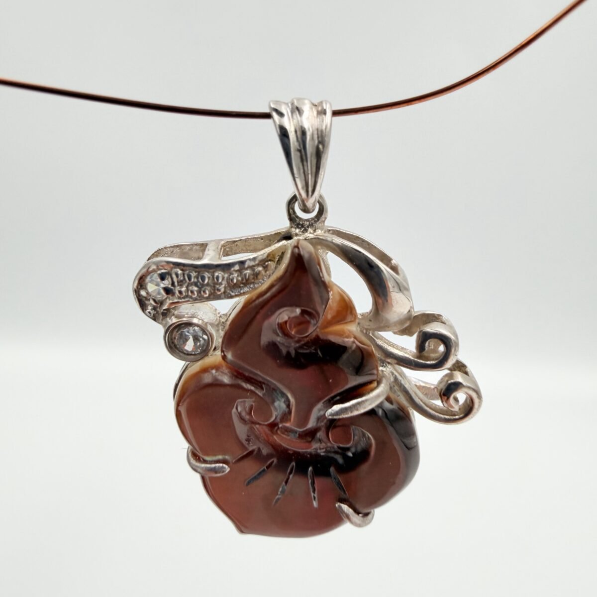 Alternative view of Brown Shell flame pendant