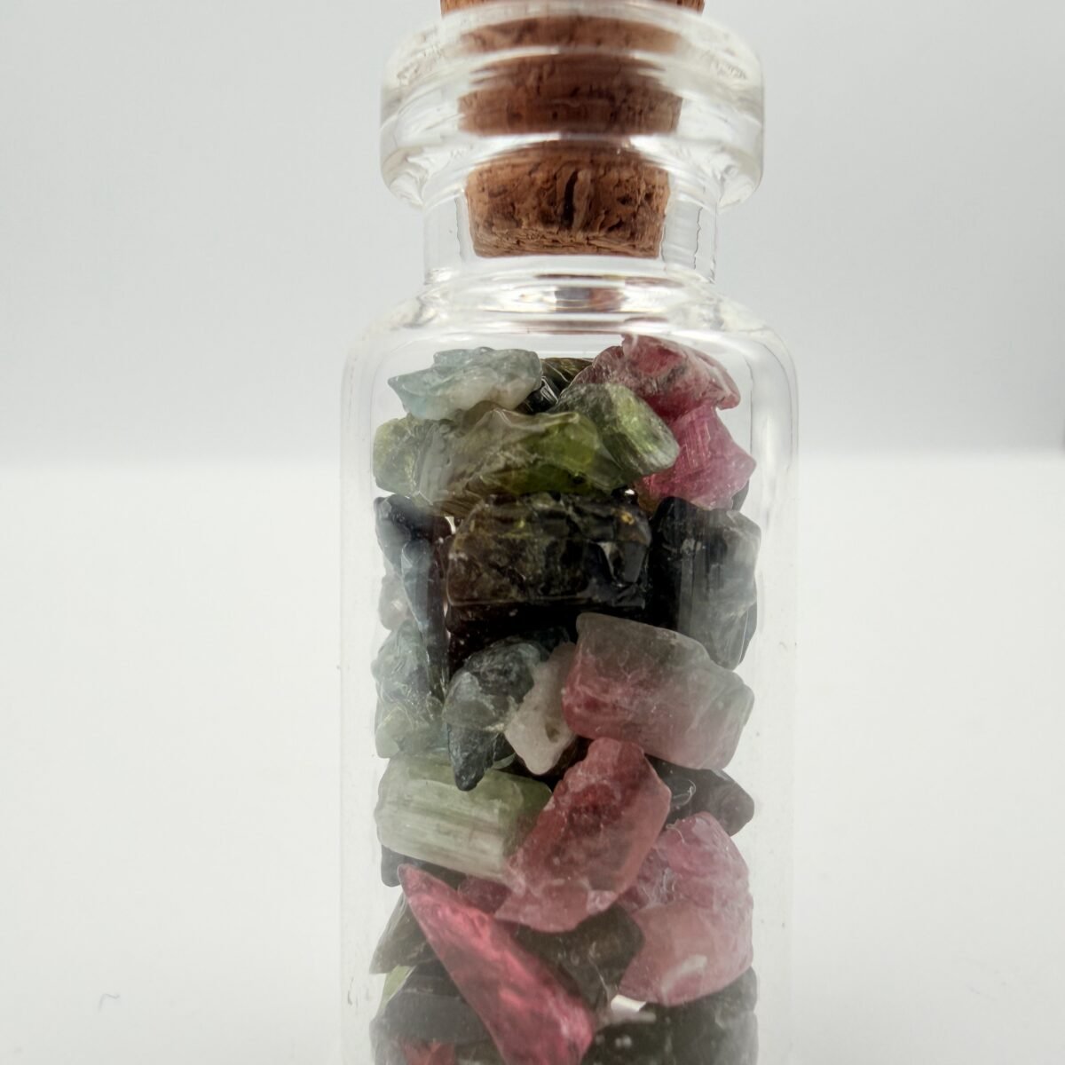Watermelon Tourmaline Rough Stones in Decorative Glass Bottle – Natural Crystal Specimen
